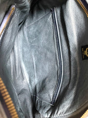 Vintage MCM navy and white monogram round shape Suzy Wong shoulder bag with leather trimmings. West Germany. By Michael Cromer. 0410134
