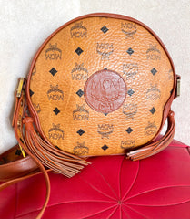 Vintage MCM brown monogram round Suzy Wong shoulder bag with brown leather trimmings. Designed by Michael Cromer. Unisex. 050120an9