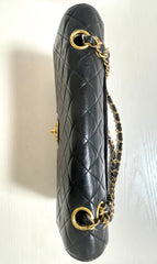 80's vintage Chanel black 2.55 shoulder bag with circle CC flap design. Rare piece from the era. 0410283