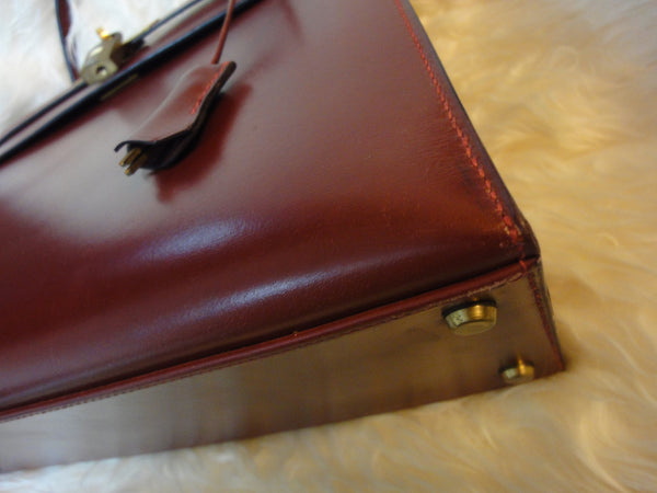 Sold at Auction: HERMÈS, Kelly Retourné 32 bag, Rouge H box calf leather,  with gilt metal hardware