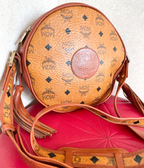 Vintage MCM brown monogram round Suzy Wong shoulder bag with brown leather trimmings. Designed by Michael Cromer. Unisex. 050120an9