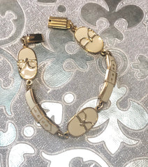 Vintage Roberta di Camerino chain bracelet with white logo charms. Beautiful jewelry.