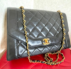 Vintage Chanel black lambskin chain 2.55 shoulder bag with gold chain. Unique hexagon shaped flap. 0407012