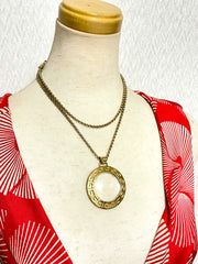 Vintage Givenchy golden chain necklace with round loupe top. Must have statement necklace. 0409274