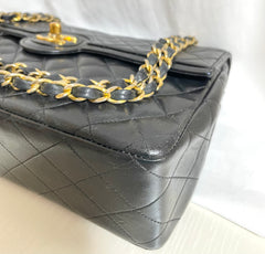 80's vintage Chanel black 2.55 shoulder bag with circle CC  flap design. Rare piece from the era. 0410283