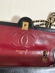 80's vintage Chanel black 2.55 shoulder bag with circle CC flap design. Rare piece from the era. 0410283