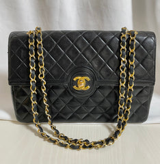 80's vintage Chanel black 2.55 shoulder bag with circle CC flap design. Rare piece from the era. 0410283