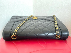 Vintage Chanel black lambskin chain 2.55 shoulder bag with gold chain. Unique hexagon shaped flap. 0407012