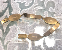 Vintage Roberta di Camerino chain bracelet with white logo charms. Beautiful jewelry.