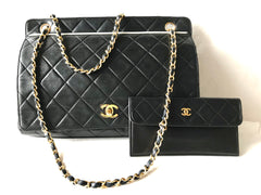 Vintage Chanel black leather 2.55 chain large shoulder bag with white trimming edge and a matching pouch. 0403284