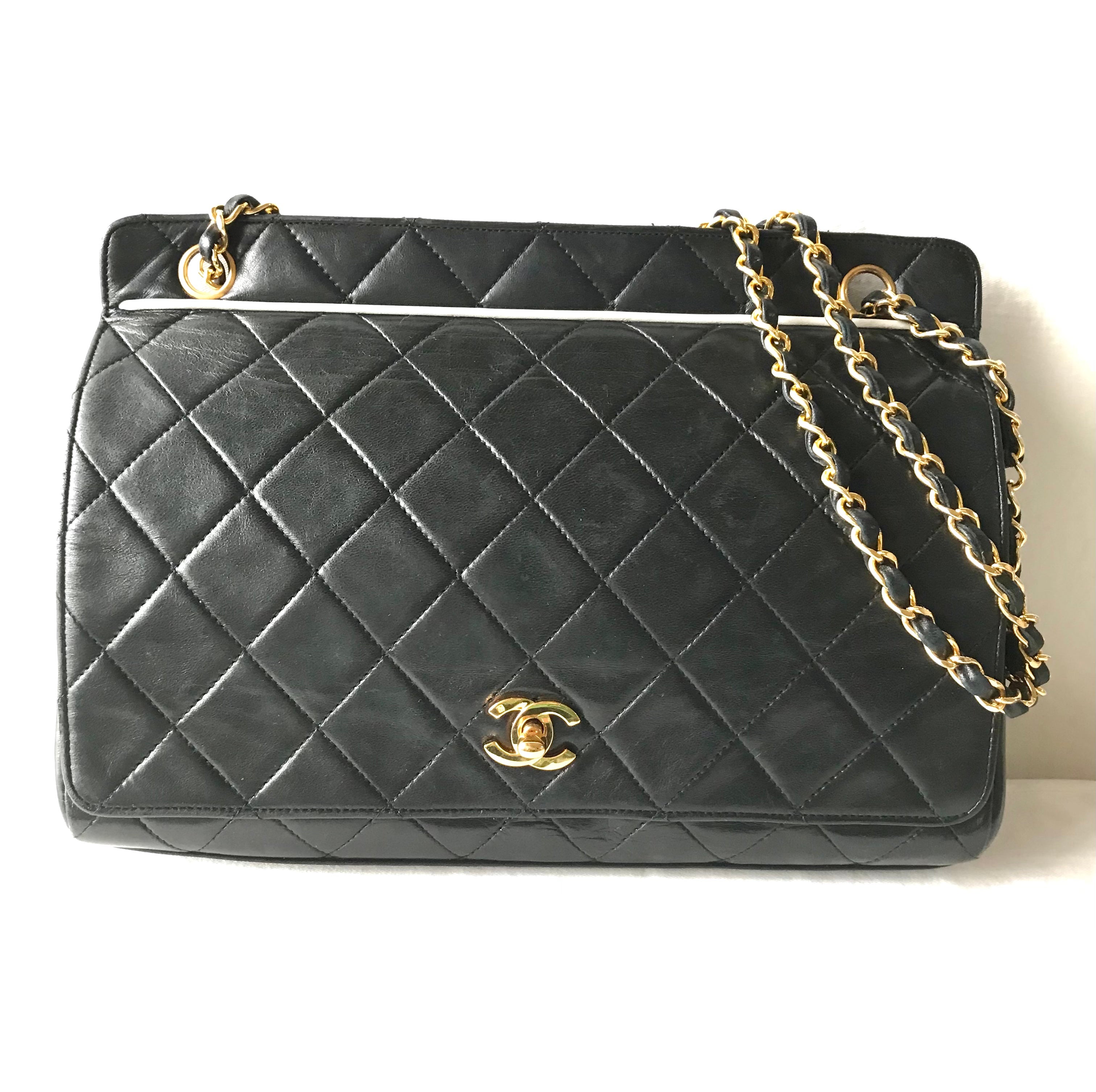 Vintage Chanel black leather 2.55 chain large shoulder bag with white trimming edge and a matching pouch. 0403284