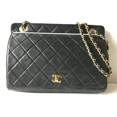 Vintage Chanel black leather 2.55 chain large shoulder bag with white trimming edge and a matching pouch. 0403284