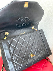 Vintage Chanel black lambskin chain 2.55 shoulder bag with gold chain. Unique hexagon shaped flap. 0407012