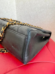Vintage Chanel black lambskin chain 2.55 shoulder bag with gold chain. Unique hexagon shaped flap. 0407012