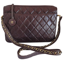 80's vintage Chanel dark brown quilted lambskin shoulder bag with CC motif and built-in chain shoulder strap. Rare Chanel purse