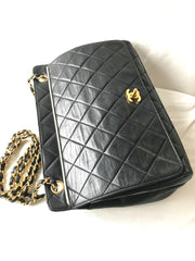 Vintage Chanel black leather 2.55 chain large shoulder bag with white trimming edge and a matching pouch. 0403284