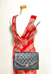 Vintage Chanel black lambskin chain 2.55 shoulder bag with gold chain. Unique hexagon shaped flap. 0407012