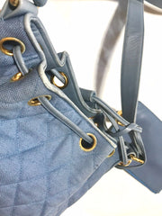 Vintage CHANEL blue quilted canvas and leather combo hobo bucket shoulder bag with drawstrings and golden CC mark balls. 060905r3