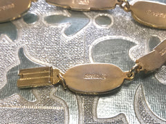Vintage Roberta di Camerino chain bracelet with white logo charms. Beautiful jewelry.