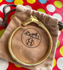 Vintage Hermes golden horse head design bangle, bracelet. Beautiful classic jewelry from Hermes. 0411101