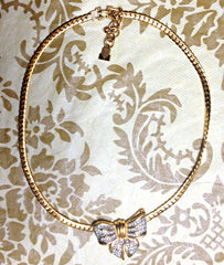 Vintage LANVIN golden thick chain statement necklace with large ribbon bow and crystal stone pendant top. Perfect vintage jewelry.