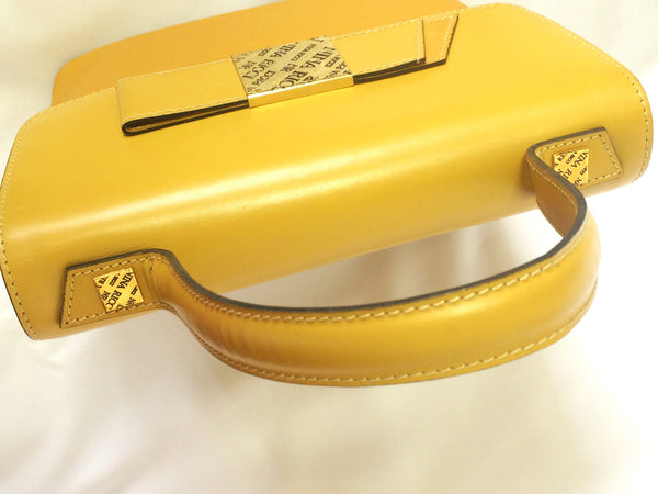 MINT. Vintage Nina Ricci yellow leather handbag purse with