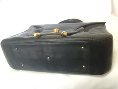 Vintage Bally black leather retro pop design bag, business purse with gold tone drawstrings and unique flap cut design. Unisex use. 160315