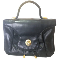 Vintage Bally black leather retro pop design bag, business purse with gold tone drawstrings and unique flap cut design. Unisex use. 160315