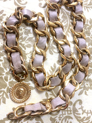 80's Vintage CHANEL beige leather thick chain belt with golden CC and mademoiselle charm. Nice and heavy single layer belt from CHANEL.