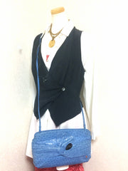 1980s. Vintage BALLY genuine blue ostrich leather shoulder bag with gathered knot, bow design and black motif. Made in W. Germany. 050406r3