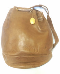 Vintage Christian Dior brown genuine nappa leather backpack design, large hobo bucket shoulder bag with golden logo. Unisex