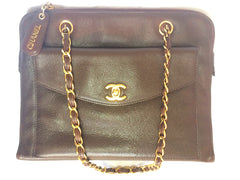 Vintage CHANEL dark brown caviarskin chain shoulder tote bag with golden CC closure. Classic and daily use bag