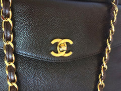 Vintage CHANEL dark brown caviarskin chain shoulder tote bag with golden CC closure. Classic and daily use bag
