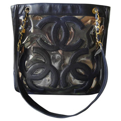 Vintage CHANEL clear vinyl and navy leather combination shoulder purse, tote with CC marks and matching pouch. Golden chain.