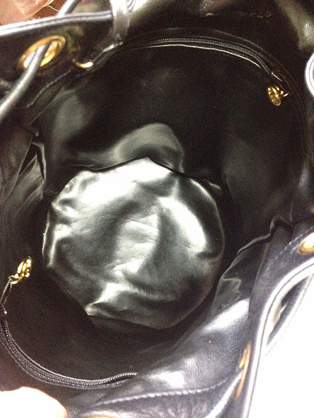 Vintage CHANEL black lamb leather golden chain shoulder bag in round drum  shape.