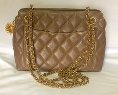 Vintage CHANEL cocoa brown caviar leather chain shoulder bag with golden sun flower CC mark charm. Classic bag