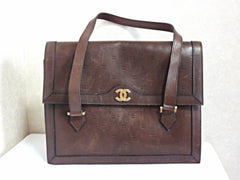 70s, 80s vintage CHANEL cocoa brown calfskin handbag with gold tone CC motif and mini CC motifs allover. Rare masterpiece back in the era.