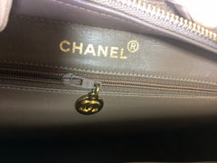 Vintage CHANEL cocoa brown caviar leather chain shoulder bag with golden sun flower CC mark charm. Classic bag