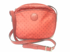 80's vintage FENDI red oval round shape shoulder purse with small FF logo print allover. So chic and cute.
