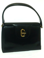 Vintage Gucci black leather classic design handbag purse with G hardware turnlock closure and red interior lining. Perfect Gucci bag