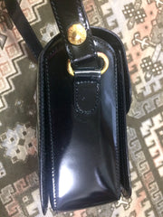 Vintage MOSCHINO black patent enamel leather shoulder bag with red heart motif at closure. Must have mod purse by Red Wall.