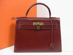 1980s Vintage HERMES Kelly 32 bag rouge ash box calf leather with gold hardware. Exterior stitch. Stamp K in O, 1981. Best known classic bag
