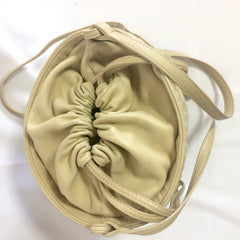 Vintage BALLY ivory white quilted lambskin mini hobo, bucket shoulder bag with golden B charm and drawstrings.