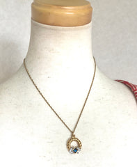 Vintage LANVIN golden skinny chain necklace with golden round pendant top. Clear crystals and green glass stone. Perfect jewelry gift.