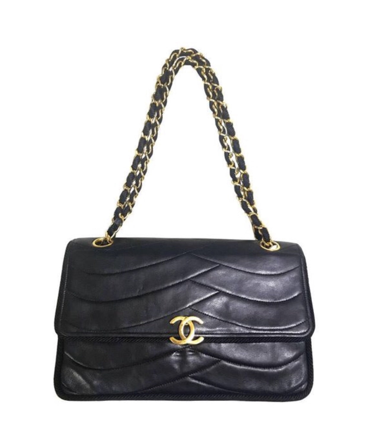 80's vintage Chanel black 2.55 shoulder bag with wavy stitches and rope strings and gold chain strap. Very rare piece from the era