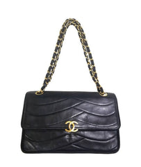 80's vintage Chanel black 2.55 shoulder bag with wavy stitches and rope strings and gold chain strap. Very rare piece from the era