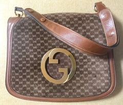 Vintage Gucci brown leather micro GG print shoulder bag with iconic golden large round GG motif. Rare masterpiece purse.