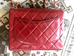 Vintage CHANEL deep red lambskin mini 2.55 bag with golden CC and chain strap. Classic Chanel red bag back in the era.