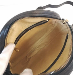Vintage MCM black monogram round shape Suzy Wong shoulder bag with leather trimmings and fringes. Unisex. West Germany made.