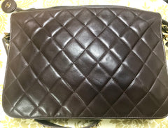 80's vintage Chanel dark brown quilted lambskin shoulder bag with CC motif and built-in chain shoulder strap. Rare Chanel purse